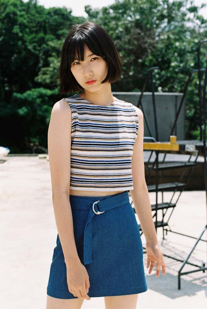 Primary denim buckle skirt High-waisted skirt in a weighty denim with a clean finish and a slight A-line silhouette. The removable D-ring buckle belt adds interest to this minimalist piece.