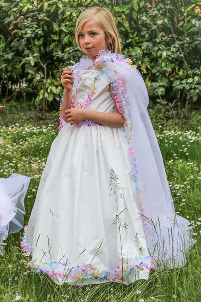 Bodice and skirt trimmed with a rainbow garland of