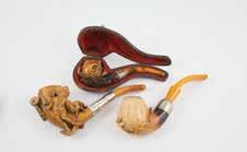 unsmoked 760 Three Meerschaum Pipes bowls carved with Bacchus, Turk and dog, unsmoked 761 Collection of Seven Pipes four small, Turks head carved, plain meerschaum and telescopic 762