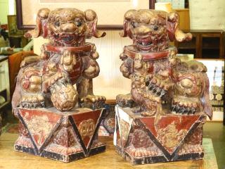 426 Pair of carved and pierced wooden Foo Dogs.