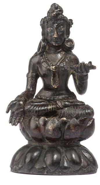 8 SEATED BRONZE PRAJNAPARAMITA Swat valley ca. Seventh century Height: 9.1 cm, 3 ½ in The female figure, goddess of wisdom, can be identified by the book she holds in her raised left hand.