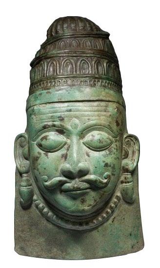 13 BRONZE REPOUSSE MASK OF SHIVA Probably northern Pakistan ca. fifteenth century Height: 30 cm, 11 ¾ in The mask continues a long tradition of masks from the North-West.