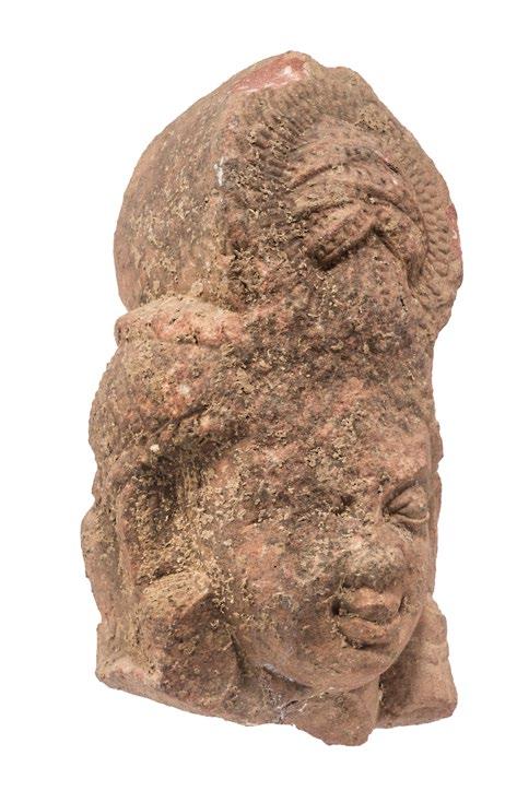 2 RED SIKRI SANDSTONE ADDORSED HEADS Kushan period ca. second/third century AD, Mathura Height: 17 cm, 6 ⅝ in The conjoined heads are of identical design.