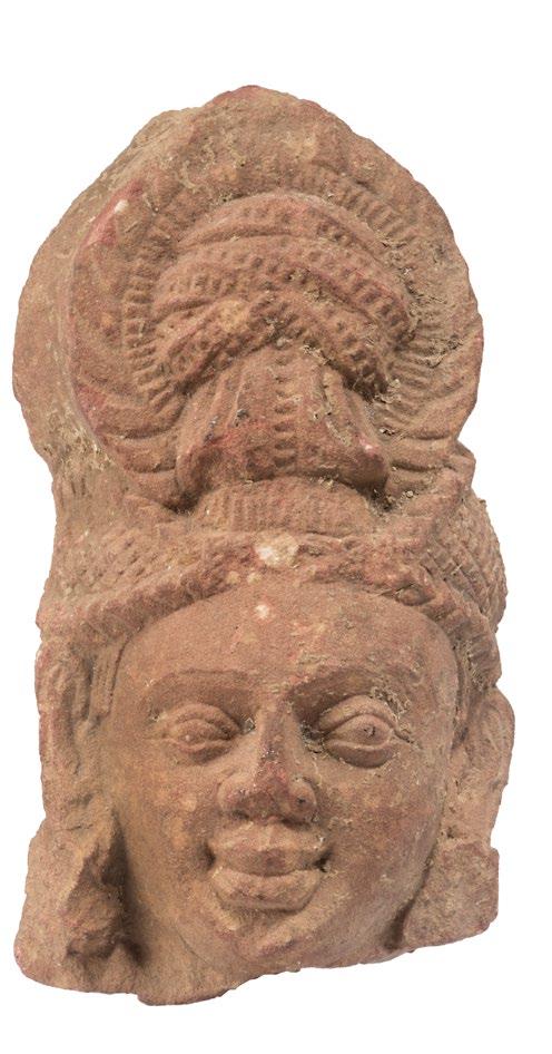 The abrasion is certainly ancient since the area is thickly covered in lime-scale. The other head is undamaged and crisply carved.
