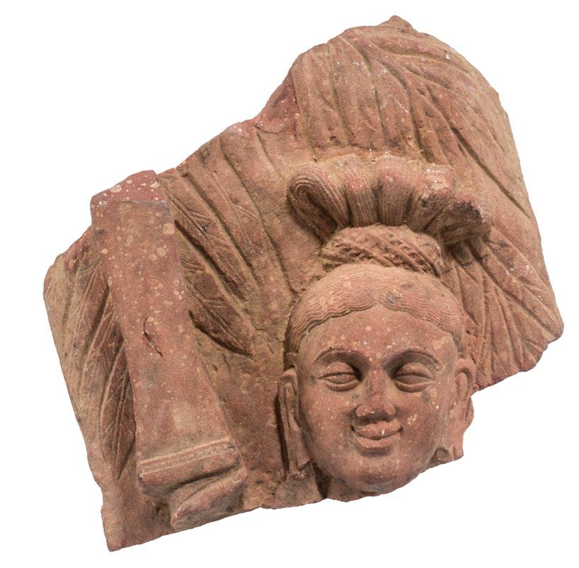 3 A RED SIKRI SANDSTONE FRAGMENT OF YAKSHI WITH RAISED SWORD ca. third century Mathura wood stand Height 18.