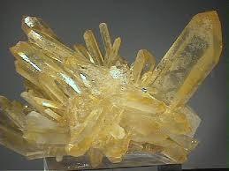 Color and varieties Pure topaz is colorless and transparent but is usually tinted by impurities; typical topaz is wine, yellow, pale gray, reddish-orange, or blue brown.