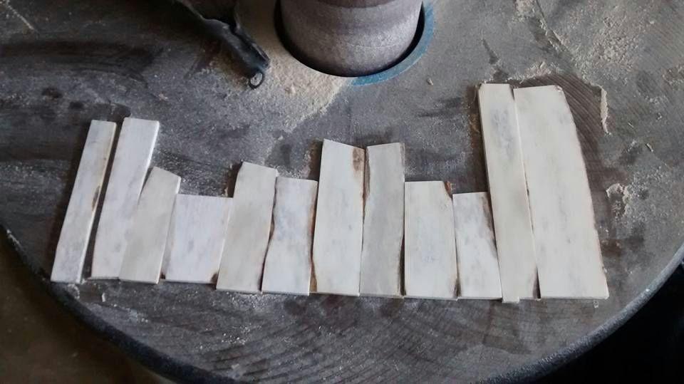 largest areas of useable material. The pieces were then cut down to workable pieces using a bandsaw and then run through a drum sander to create a uniform thickness.