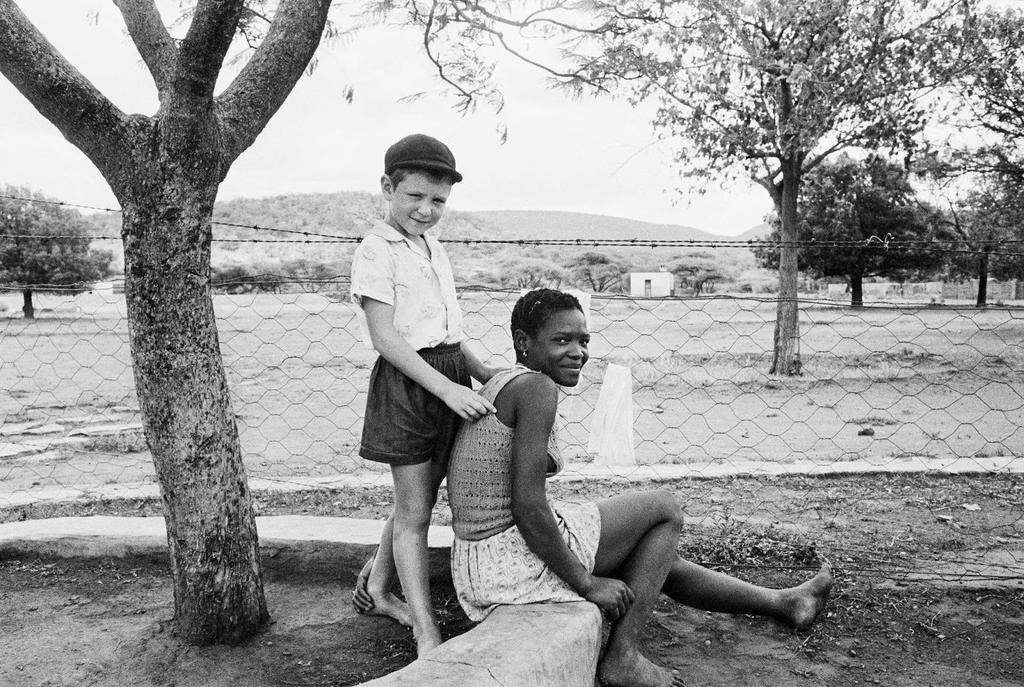 A farmer s son with his nursemaid in Heimweeberg, Nietverdiend, Western Transvaal, 1964.