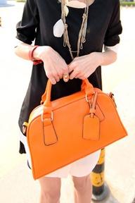 Dress in classic pieces, then carry a vintage or very trendy handbag to bring lots of visual interest to
