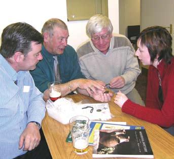 Z Z Portable Antiquities Scheme Finds Liaison Officer talking with members of the Danum Arc Metal-detecting Club about their finds.