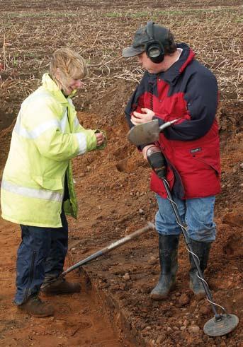 B A Metal detector survey as part of an archaeological project on a Roman site in Lincolnshire.