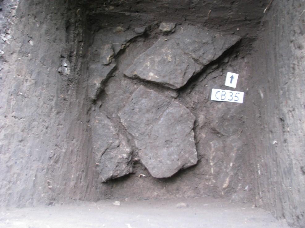 CB35 NE corner, showing the layer of brick pieces at c 65cm