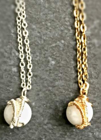 5 long with chain. WS: $13.50, MSRP: $30.50, (SKU: JAN-S01) C. Gold Pearl Necklace - 0.50 tall x 0.34 wide x 18.