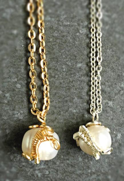 Gold Moonstone Necklace - 0.50 tall x 0.34 wide x 18.5 long with chain. WS: $15.50, MSRP: $35.
