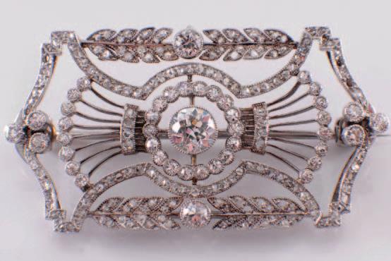 62 291 A Belle Epoque diamond mounted rectangular plaque brooch of pierced openwork design,