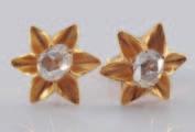 299 301 304 300 299 A pair of rose diamond mounted single-stone earstuds of
