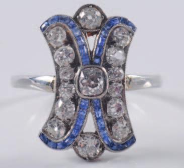 500-700 322 An opal and diamond circular cluster ring with central circular opal claw-set within a