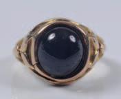 337 340 338 337 A 15ct gold and cabochon garnet single-stone ring.