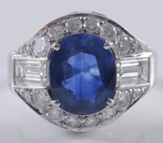 349 A sapphire and diamond mounted ring with central oval sapphire approximately 11.3mm x 9.2mm x 4.