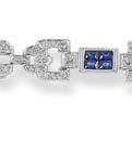 70 carat, ring size L 1,000-1,500 81 A sapphire and diamond pendant and pair of earrings The curved pendant set with four