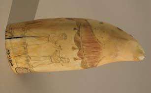 UNUSUAL POLYCHROMED SCRIMSHAW WHALE TOOTH, circa 1850, depicting a boxing match under a
