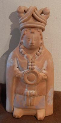Statues Of Women With Large Headdress And Long Hulpil (wall plaque) This figure is a rattle in the shape of a Mayan lady wearing the typical