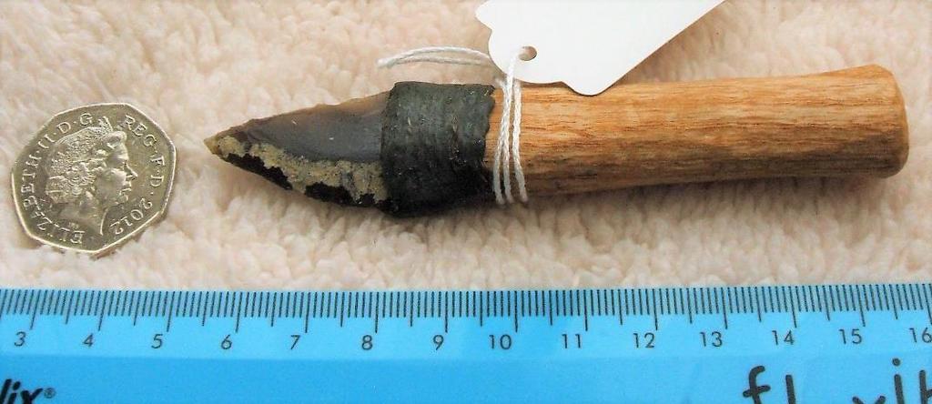 Item: 7 Brief Description: Small Knife This knife is made from oak with a flint blade. The blade was attached to the handle with twine and fixed in place with pine resin and beeswax.