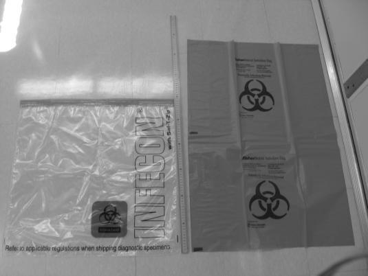 Biohazard and Infecon Waste Disposal Bags - When a Biohazard bag (orange or red bag, on right) is full, place it into an "Infecon" bag (clear, with sealable "zip-lock" style opening, on left).