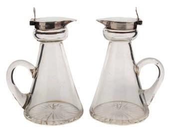 105 105 A pair of George V clear glass and sliver mounted whisky noggins, maker Goldsmiths & Silversmiths Co, Ltd.