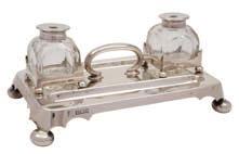 * 150-180 24 24 A Victorian silver inkstand, maker David & George Edwards, Sheffield, 1898 of rectangular outline, the central loop