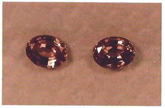 Two of these stones (1.50 ct each) are shown in figure 1 as seen in incandescent light. In daylight or fluorescent light they are blue-green with areas of purple.
