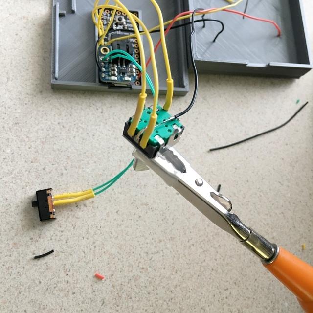 Connect the final wire from the ItsyBitsy (from D12) to the buzzer. It doesn't matter which connection.