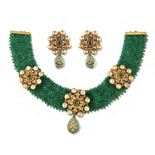 , Jaipur A lush green flat necklace knitted with emerald beads is punctuated with floral motifs composed with