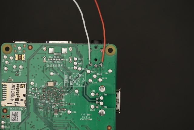 Add a small amount of solder to these points. Solder Audio Wires to Pi Hit those points with the iron and solder the wires to positive and ground.