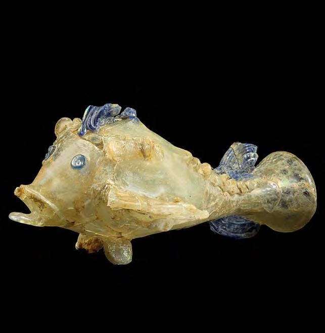 Image 10 Fish-shaped flask, 1 200 c e. Afghanistan; Begram, Room 10. Glass. National Museum of Afghanistan. What is represented here? A naturalistic, lifelike fish is represented in glass.