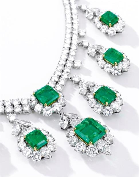 bluish-green body colour is highly uncommon. This natural 35.72-Carat Step-Cut Colombian Emerald and Diamond Ring (Est. HK$32 36 million / US$4 4.6 million, pictured on p.