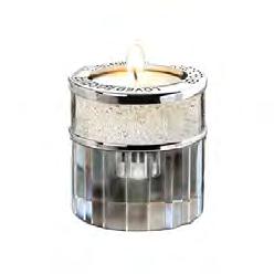 126 125 127 The silver tealight shows an engraving option which is available on all crystal tealights at an additional price. 125. Crystal Heart Available in gold or silver with a matching cylinder and supplied with a black lacquer box.