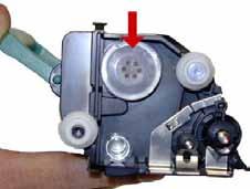 Once the plastic sealing plug is viewable, slowly and gently, pry the SEALING PLUG away from the cartridge using a flathead screwdriver this reveals the