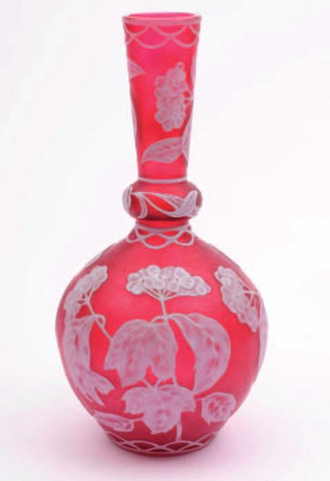 534. A Stevens & Williams cameo glass vase of globular form with mildly flaring neck and neck ring, the clear, red and white overlaid body cut and etched with Hydrangea blooms and foliage between