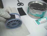 TM Acryl-Blue. 3. After the putty has dried, begin sanding the area with 220-grit sandpaper, finishing with 40
