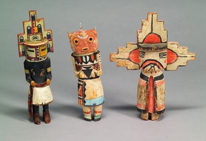 253 254 255 250. Three Polychrome Carved Wood Katcina Dolls, Hopi, c. mid-20th century, all wearing large case masks, the smaller a Route 66 doll, one with a Hopi Village sticker, ht. to 8 1/2 254.