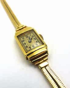 1044 A ladies 18ct yellow gold wristwatch by Longines, the rectangular dial with black Arabic numerals within a stepped case, overall 23.