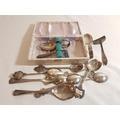 Tray of interesting items to include coins, flat ware and jewellery 68.