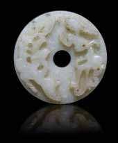 1 4 9 12 14 13 1 A Jade Duck of a pale celadon stone, depicted with a ruyi sprig in its beak. Width 1 3/4 inches.