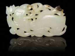 reverse. Diameter 2 1/4 inches. $2,500-3,500 13 A Jade Toggle of an even white stone, depicting a mother goose and a gosling. Width 2 inches.