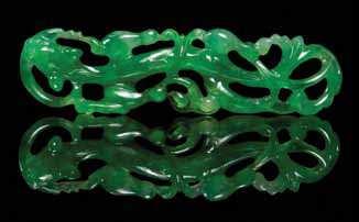 and a green jadeite example worked to show mythical beasts and a bat on an eggplant. Height of largest 2 1/4 inches.