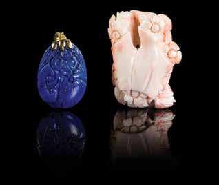 Width 1 5/8 inches. 785 A Carved Lapis Lazuli Pendant worked to show a loral blossom and lingzhi, together with a carved baby-face coral toggle. Height of irst 1 1/2 inches.