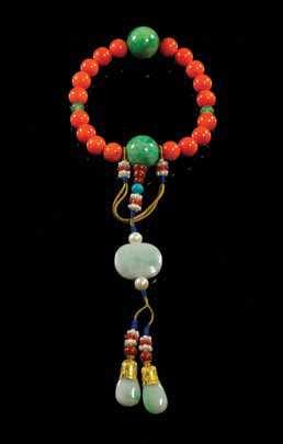 $1,800-2,000 798 A Red Coral and Aquamarine Court Necklace, Chaozhu comprising 108 coral beads spaced with larger lapis lazuli beads, having three strands