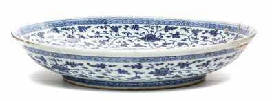 underside. Diameter 6 3/4 inches (each). $400-500 890 A Blue and White Porcelain Bowl of circular, footed form, decorated with lotus scrolls, bearing a six-character Hongzhi mark to the underside.
