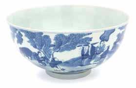 902 A Blue and White Porcelain Footed Bowl decorated to show a continuous band of scrolling lotus, bearing apocryphal six-character Qianlong mark in underglaze blue. Diameter 4 3/4 inches.